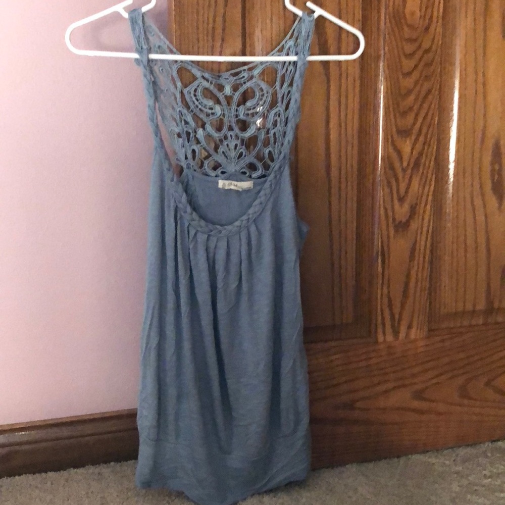 Gray tank top. Braided straps and designed back